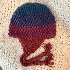 Hand crochet hat with earflap braided ties.